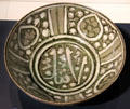 Fritware bowl painted with Arabic script from Iran at Aga Khan Museum. Toronto, ON.