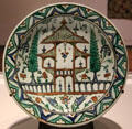Fritware dish painted with oriental garden from Iznik, Turkey at Aga Khan Museum. Toronto, ON.