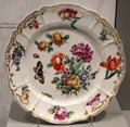 Porcelain plate painted with flowers & butterflies from Hof service attrib. Joseph Zachenberger for Nymphenburg of Munich, Germany at Gardiner Museum. Toronto, ON.