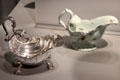 Shell-shaped sauce boats in silver from London & porcelain from London at Gardiner Museum. Toronto, ON.