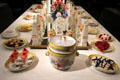 Porcelain dessert table setting by Derby around Sevres centerpiece at Gardiner Museum. Toronto, ON.