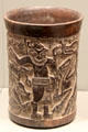 Maya Late Classic earthenware cylinder vessel with carved hunting scene from Petén lowlands, Guatemala at Gardiner Museum. Toronto, ON.