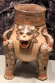 Costa Rica earthenware jaguar effigy tripod vessel with rattle legs from Nicoya zone at Gardiner Museum. Toronto, ON