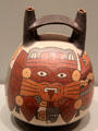 Nazca culture earthenware vessel with mythical warrior motif from South Coast Peru at Gardiner Museum. Toronto, ON.