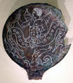 Etruscan bronze mirror back depicting giant sea creatures at Royal Ontario Museum. Toronto, ON