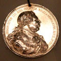 Silver Indian peace medal with portrait of King George III marking end of War of 1812 made in London at Royal Ontario Museum. Toronto, ON.