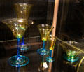 Steuben glass goblet collection in transparent amber on celeste blue stems by Frederick Carder of Corning, NY at Royal Ontario Museum. Toronto, ON.