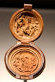 Carved boxwood prayer bead with Christ carrying Cross above & the Lamentation below at Art Gallery of Ontario. Toronto, ON.