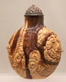 Japanese snuff bottle with figures in mixed brown colors at Art Gallery of Ontario. Toronto, ON.