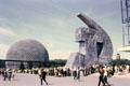 Geodesic dome of United States Pavilion with socialist realism hammer & sickle sculpture beside USSR Pavilion at Expo 67. Montreal, QC.