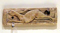 Coptic culture carved plaque of running hare from Egypt at Montreal Museum of Fine Arts. Montreal, QC.