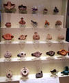 Collection of Mediterranean earthenware oil lamps at Montreal Museum of Fine Arts. Montreal, QC.