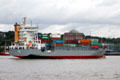 Container ship, Bjorg, St John's, with life boat & slide, traveling along Elbe River. Hamburg, Germany.