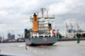 Container ship, Bjorg, St John's, traveling past container port. Hamburg, Germany.