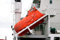 Sealed, waterproof life boat on slide for fast evacuation on container ship. Hamburg, Germany