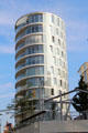 Oval glass building at Am Kaiserkai 10-12 in HafenCity. Hamburg, Germany.
