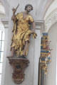 Statue of St Bartholomew with symbolic knife & flayed skin at Peterskirche. Munich, Germany