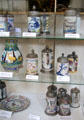Collection of German ceramic bier mugs & vessels painted with hunting topics at German Hunting & Fishing Museum. Munich, Germany.