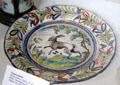 German faience plate painted with leaping rabbit at German Hunting & Fishing Museum. Munich, Germany.