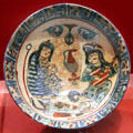 Earthenware bowl with musicians from Iran at Five Continents Museum. Munich, Germany.