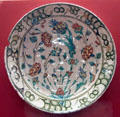 Ceramic plate painted with flowers from Iznik, Turkey at Five Continents Museum. Munich, Germany.