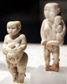 Egyptian predynastic ivory figures of women with child at Neues Museum. Berlin, Germany