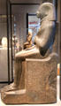Egyptian stone statue of Mentechenu, chief of royal guard from Thebes Karnak at Neues Museum. Berlin, Germany.