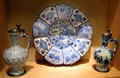 Ceramic ridged plate & covered jugs painted in Delft style made in Germany by Dutch artists fleeing religious persecution in Netherlands at German Historical Museum. Berlin, Germany.