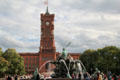 Rotes Rathaus beyond Neptune Fountain. Berlin, Germany.