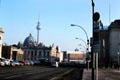 Unter den Linden with Cathedral dome, TV Tower & copper colored modern East German Parliament. Berlin, Germany.