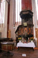 Inlaid pulpit & baptismal font at St Mary's Church. Greifswald, Germany.