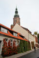 Streetscape with St Nicholas Church tower. Greifswald, Germany.