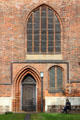 Brick Gothic entrance & windows of St Nicholas Church. Greifswald, Germany.