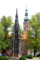 Heinrich Rubenow monument with St Nicholas Church tower. Greifswald, Germany.