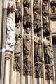 Saint figures flanking south entrance doors to Köln Cathedral. Köln, Germany.
