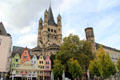 Towers of Great St Martin church with Fischmarkt area in foreground. Köln, Germany.