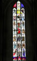 Modern stained glass window of nobles facing skeletons of death at St Mary's Church. Lübeck, Germany.