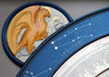 Eagle symbol of Evangelist St John on saints day calendar clock at St Mary's Church. Lübeck, Germany.