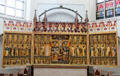 Altar with crucifixion flanked by Apostles & Saints at St Mary's Church. Rostock, Germany.