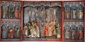 Carved wooden altar with Crucifixion scene flanked by Apostles at Schleswig Holstein State Museum. Schleswig, Germany.