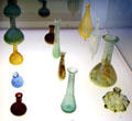 Small Roman glass flasks for cosmetics & fragrant oils at Trier Archaeological Museum. Trier, Germany.