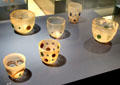 Roman glass beakers with imitation stone inclusions at Trier Archaeological Museum. Trier, Germany.