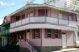 Two-tone pink corner building. Roseau, Dominica.