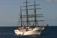 Three-masted sailing cruise ship Sea Cloud II approaching port. Dominica.