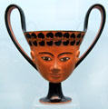 Greek terracotta Kantharos wine cup with face design from Eastern Greece at Antikensammlungen. Munich, Germany