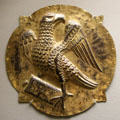 German gilded copper carving of winged eagle symbol of Evangelist St John at Bavarian National Museum. Munich, Germany.