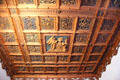 Carved wooden ceiling with annunciation scene from prince-bishop's Passau palace at Bavarian National Museum. Munich, Germany.