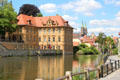 Concordia palace over canal traversing Bamberg. Bamberg, Germany