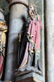 Carving of St Catherine of Alexandria with wheel & sword symbols at St Sebaldus Church. Nuremberg, Germany.