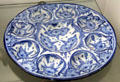 Blue-painted ceramic plate with mussel-shaped compartment from Nuremberg at Fembohaus City Museum. Nuremberg, Germany.